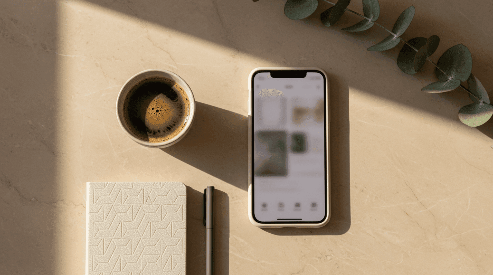A smartphone showing an Instagram profile resting beside an open laptop with a booking page